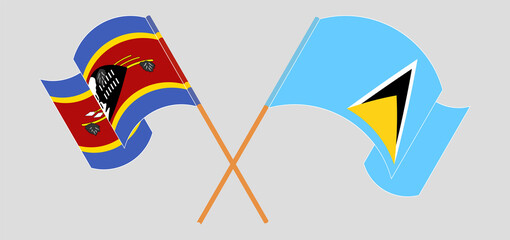 Crossed and waving flags of Eswatini and Saint Lucia