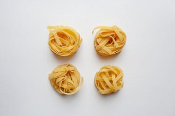 Fettuccine pasta isolated on white background from a high angle view