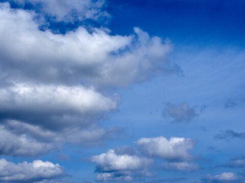 Fluffy white clouds on a vibrant blue sky © Susana