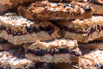 Close-up, pieces of grated pie on a shop window.