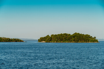 Greece, Igoumenitsa, Small green island in sea