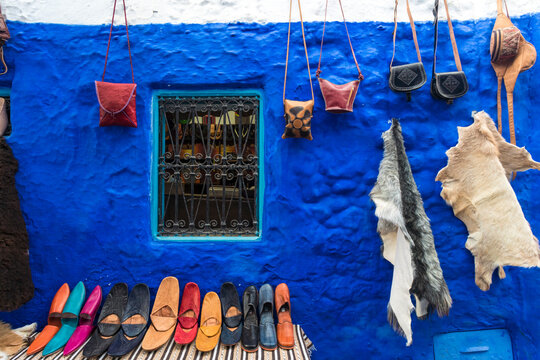 Fototapeta Morocco, Chefchaouen, Souvenirs for sale at traditional blue building