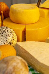 Different types of cheeses displayed on a typical Italian table, with special cutters for each type of cheese