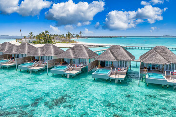 Maldives paradise island. Tropical aerial landscape, seascape with jetty, water bungalows villas with amazing sea lagoon beach. Exotic tourism destination, summer vacation background. Aerial travel - obrazy, fototapety, plakaty