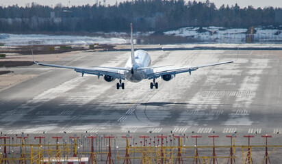 Airplane landing to airport runway 