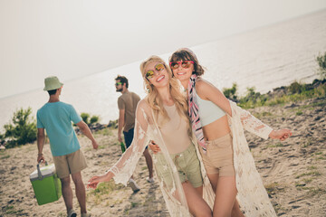 Photo of youngster hippie models enjoy midsummer festival wear casual outfit nature seaside beach...