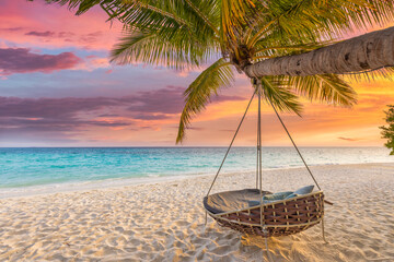 Tropical sunset beach and sky background as exotic summer landscape with beach swing or hammock and...