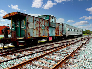 Fototapeta na wymiar vintage retired old train railroad card rusty caboose lounge car rusted abandoned empty rail machine