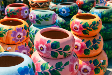 Variety of Colorfully Mexican Painted Ceramic Pots in an Outdoor Shopping Souvenir Market in Mexico.