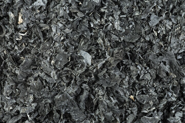 Pieces of burnt paper, as background. The ashes of the paper.