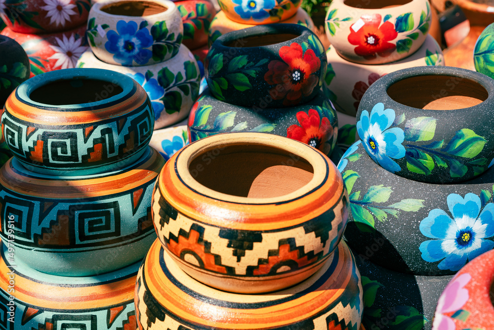 Wall mural Variety of Colorfully Mexican Painted Ceramic Pots in an Outdoor Shopping Souvenir Market in Mexico.