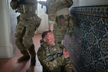 Military men helping wounded friend. Caucasian men with carrying injured teammate. Military, army,...