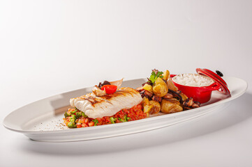 Cherne tranche with grilled octopus and potatoes on tomato tartare.