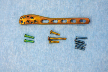 titanium surgical plate and titanium screws for the treatment of a tibia fracture