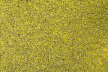 Gold, yellow background with abstract pattern of various shapes, fabric and paper texture