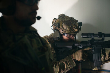 Cropped image of men playing strikeball. Men in military uniforms aiming, looking for enemies. Army, military, game, hobby concept