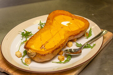 Pumpkin cream soup in half a pumpkin