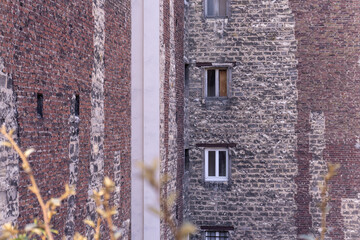 Windows in an old large Parisian brick building