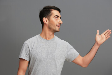 Cheerful man posing lifestyle gesture with hands cropped view