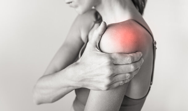 woman with pain in their shoulder joint