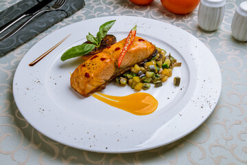 Salmon steak on the grill on white plate