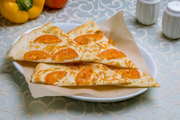 Focaccia with tomatoes on white plate