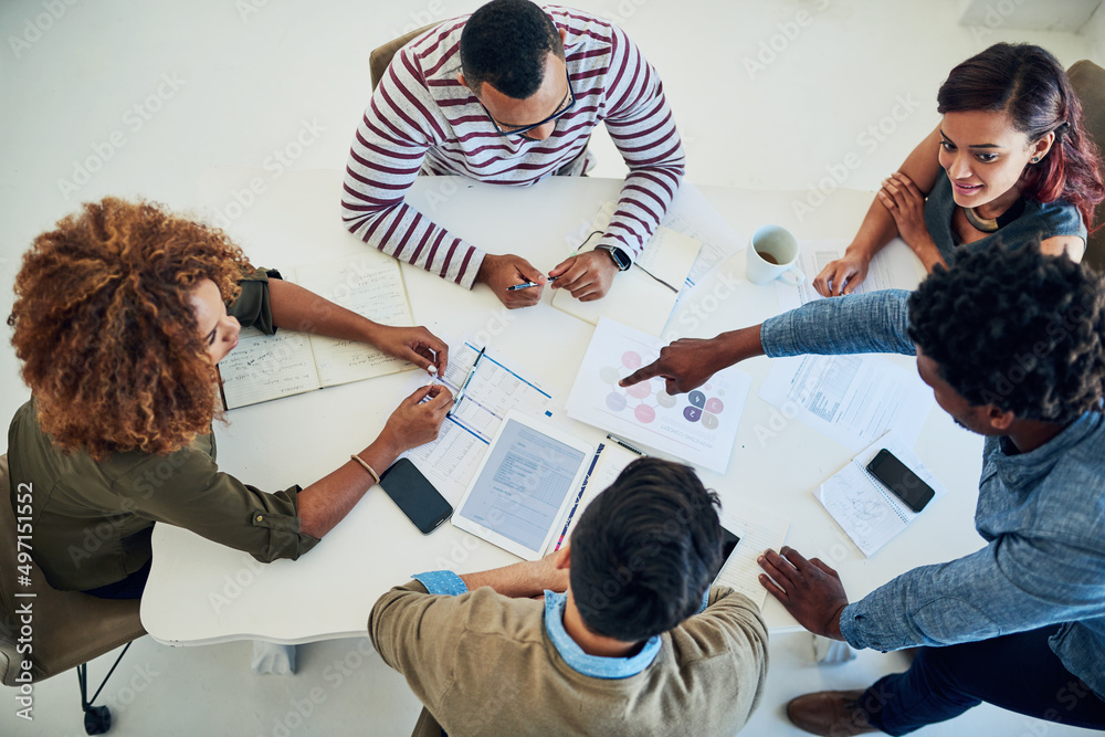 Aufkleber Sharing the workload is a sure way to success. Shot of a group of colleagues having a meeting in a modern office.