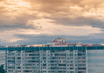 Windows and balconies of the residential building. Old urban obsolete facade of house. The windows...