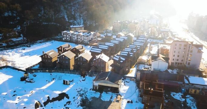 Sochi, Adler, Esto-Sadok 22 February 2022, Aerial view of the city, main road, downtown mall and mountains. Snowboarding resort, winter sports. Morning at krasnaya polyana