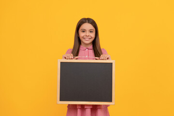 school sale. happy teen girl hold blackboard. child advertising. back to school.