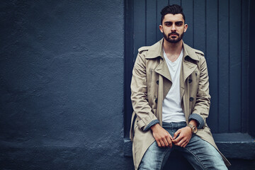 Obraz premium Fashion fresh from the streets. Portrait of a fashionable young man wearing urban wear and posing against a gray background.