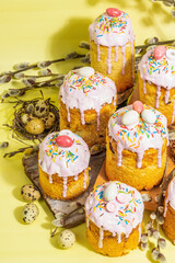 Traditional Easter cake. Festive sweet food with icing and decor. Eggs, nest, willow