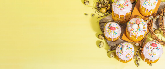 Traditional Easter cake. Festive sweet food with icing and decor. Eggs, nest, willow