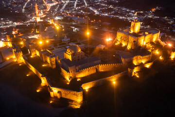 View from drone of illuminated buildings of Rabat Fortress in Akhaltsikhe at night, Georgia