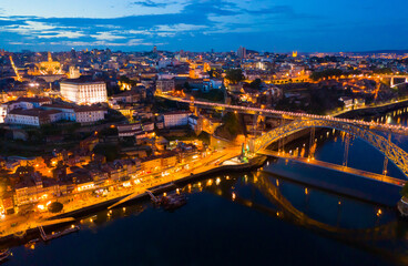 Fototapeta na wymiar Picturesque view from drone of city of Porto and Dom Luis Bridge at night, Portugal