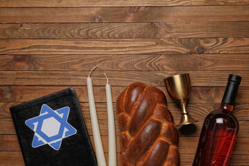 Torah with traditional challah bread, wine and candles on wooden background. Shabbat Shalom - obrazy, fototapety, plakaty