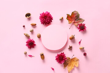 Composition with blank card, chrysanthemum flowers and natural forest decor on pink background