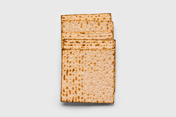 Jewish flatbread matza for Passover on white background, top view