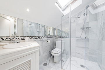 bathroom with white furniture, shower cabin with transparent sliding screen, wall-to-wall mirror,...