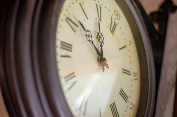 Round clock hanging on the wall