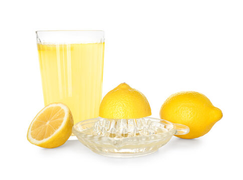 Juicer with lemons and glass of juice on white background