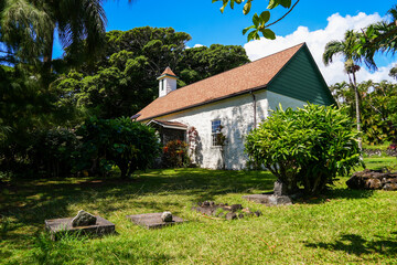 Fototapeta na wymiar Burial ground in the Palapala Ho‘omau Congregational Church in Kipahulu on Hana Highway, east of Maui island in Hawaii, United States