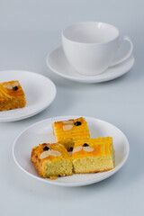 Lekkker Holland cake served with slices. The cake's real name is Dutch Buttercake or Boterkoek.