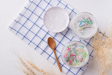 Thai dessert (Lod Chong), Colorful rice flour jelly with coconut milk in glass and ice, Top view
