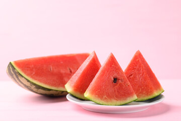 Sliced watermelon on pink color background, Tropical fruit in summer season