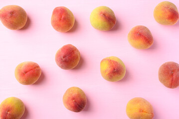 Peach fruit on pink background, Flat lay, Top view