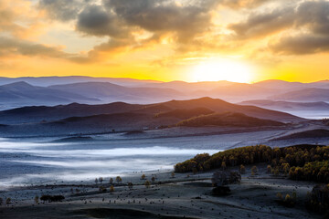 Beautiful natural landscape in Ulan Butong grassland, Inner Mongolia, China. Mountains and clouds nature landscape at sunrise.