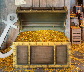 Gold Coins and treasure in a opened vintage chest