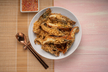 Fried Flathead lobster or Mantis shrimp fried with Garlic and Pepper Served with chili, lime, spicy sauce  , Seafood dish.