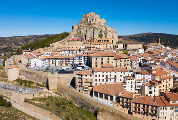 Fototapeta premium Picturesque aerial view of walled city Morella with medieval Castle on rocky hilltop, Castellon, Spain